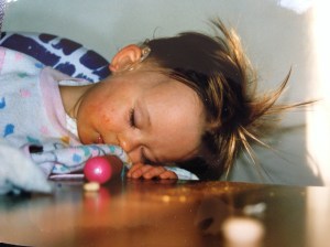 Dead asleep at the kitchen table, but hey, this photo gives a good visual of my hearing aid!